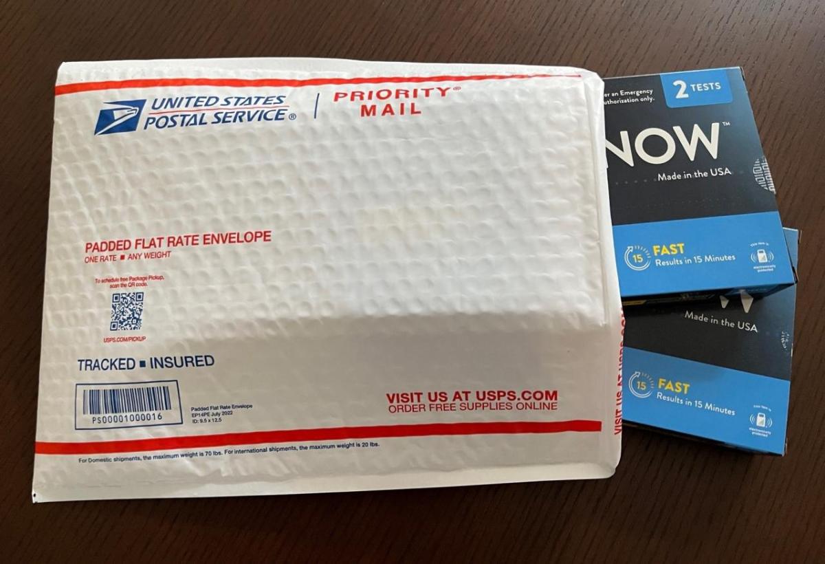 Photo of a cushioned postal mailer containing two Covid test kits