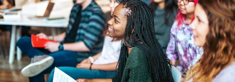 African American female shown in a classroom.