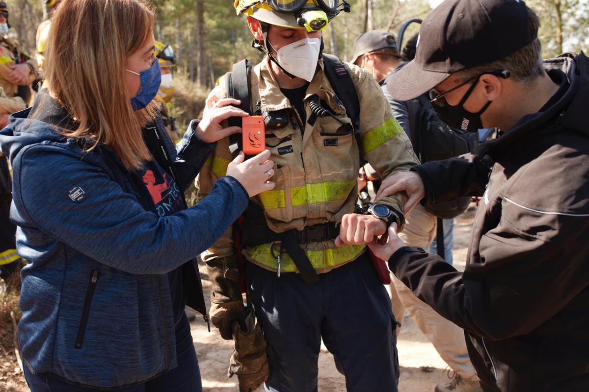 Firefighter putting on Prometeo's wearable technology 