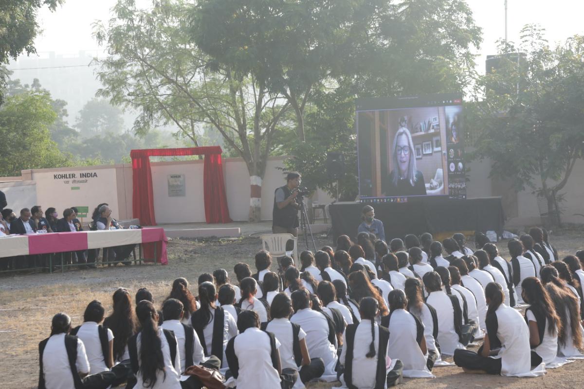 Group of students sitting in front of projector screen