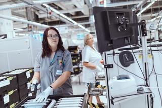 Two female workers inspecting products for quality.