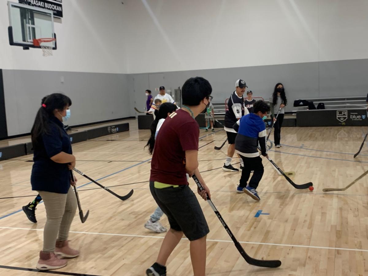 Students play ball hockey