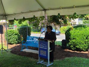 Person speaking at lectern during presentation event