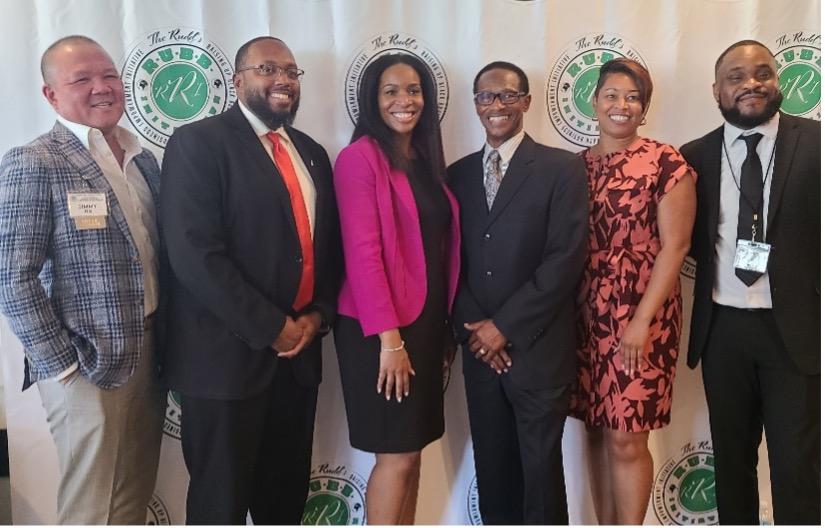 Pictured from left to right—Jimmy Ng, KeyBank Sr. Business Banking Relationship Manager; Michael Gartrell, Branch Manager; Rachael Sampson, National Director Key@Work & Key4Women; Lewis Rudd co-founder of Ezell’s Famous Chicken and founder of R.U.B.B; Cassandra Mitchell DE&I Engagement Manager at Key; Akil Primus, Branch Manager and Co-President of the African Heritage employee resource group at Key. " "