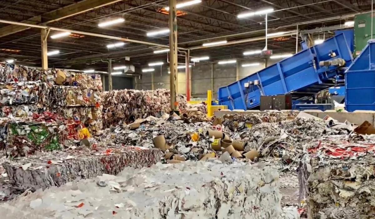Truck dropping off a load at recycling facility