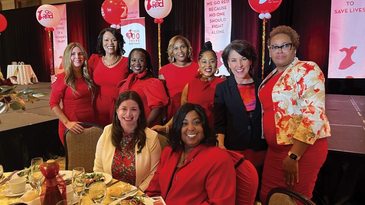 A group of women posed at a table.