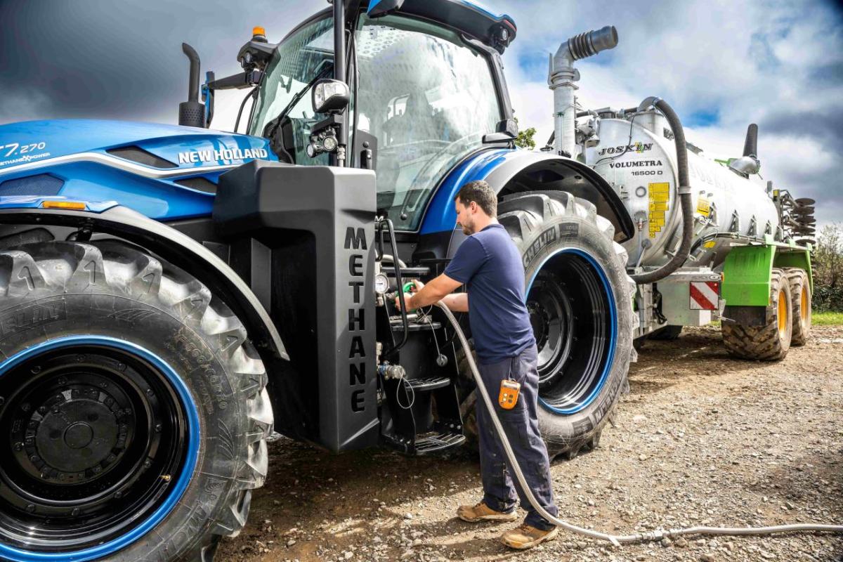 A person refueling a tractor