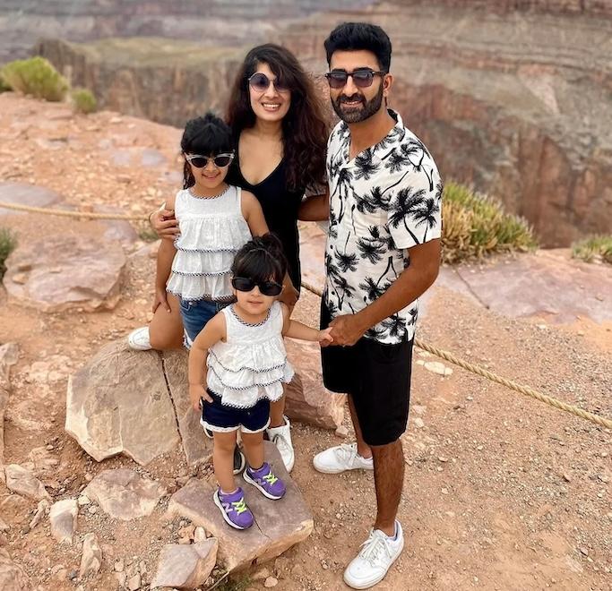 Richa Gandhi shown with her husband and two children at the Grand Canyon.