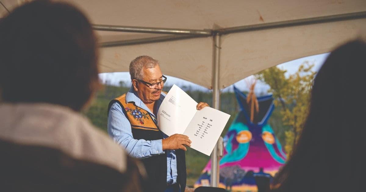 Ron Javier reading a story to others.