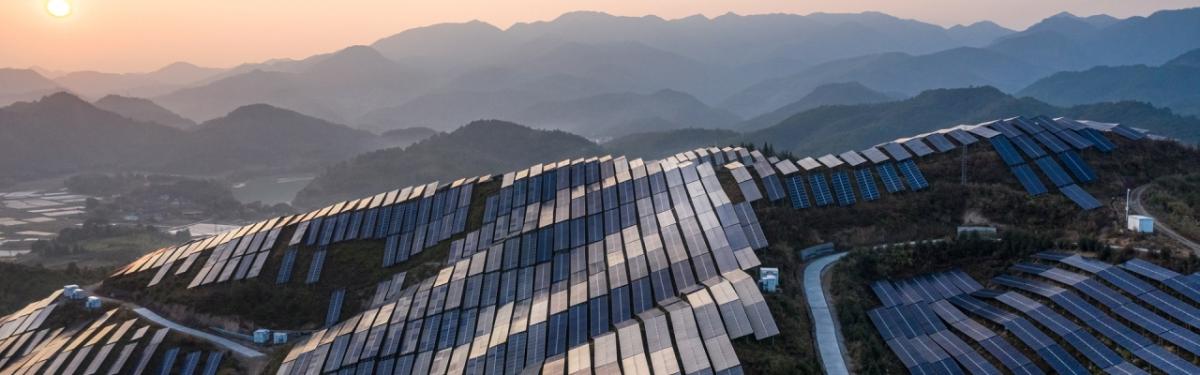 solar panels covering mountains along the skyline