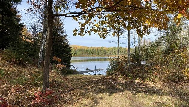 SCOPE will be improving lakeside access at this boat landing, and building an outdoor classroom paviliion, in Sawyer County, WI in the summer of 2023. A small boat landing in a forested area.