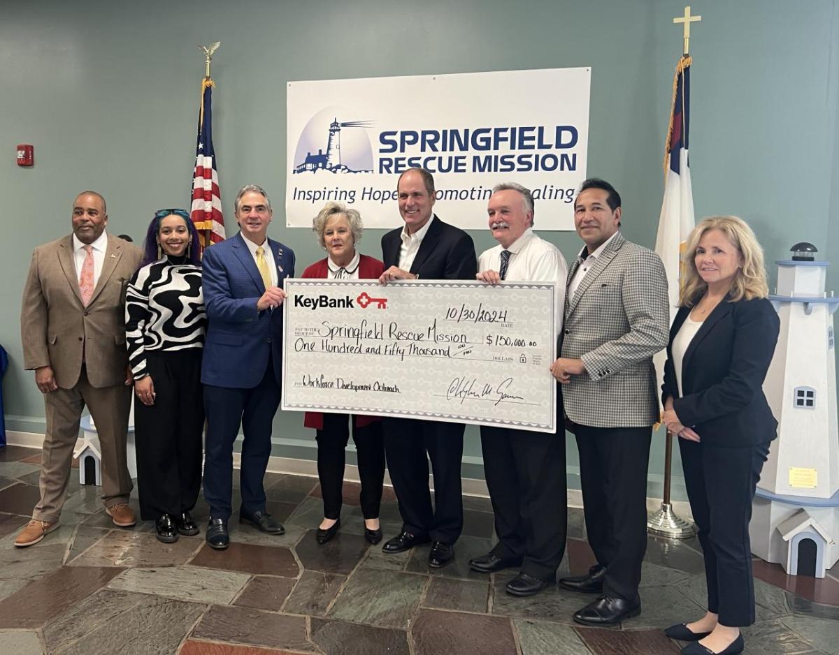 Leaders from Springfield Rescue Mission and KeyBank were joined by local officials to celebrate a $150,000 grant from KeyBank Foundation. From left: City Councilman Melvin Edwards; Lamari Jackson, District Director for the Office of Senator Adam Gomez; City of Springfield Mayor Dominic Sarno; Springfield Rescue Mission Chief of Staff Sabra Ramsdell; KeyBank Market President Matthew Hummel; Executive Director of the Springfield Rescue Mission Kevin Ramsdell, State Representative Carlos Gonzalez; and on behalf of State Representative Brian Ashe, Chief of Staff Robin Frechette. Photo credit: KeyBank. " "