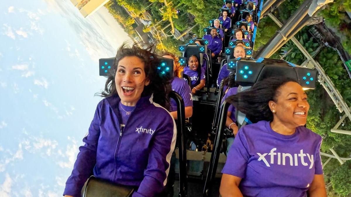 Students riding rollercoaster