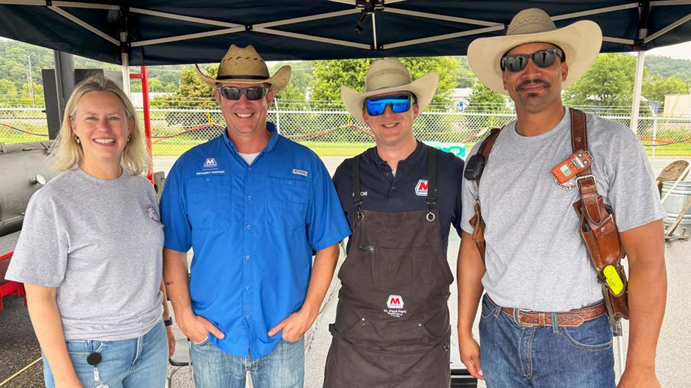 From left, Refining Environmental, Safety and Security Director Kristin Heutmaker, Fire Chief John Wright, Personal Safety Manager Michael Roache, and BBS Facilitator and Welder Obed Goodwin at the 2025 St. Paul Park refinery Safety Fair. " "