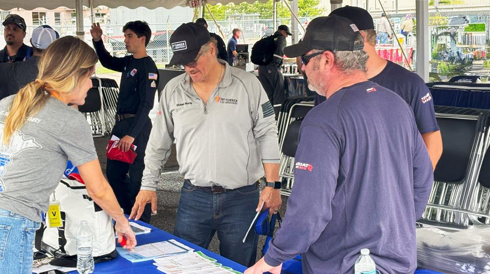 Employees visit booths and learn about different refinery processes during the 2025 Safety Fair at the St. Paul Park refinery. " "