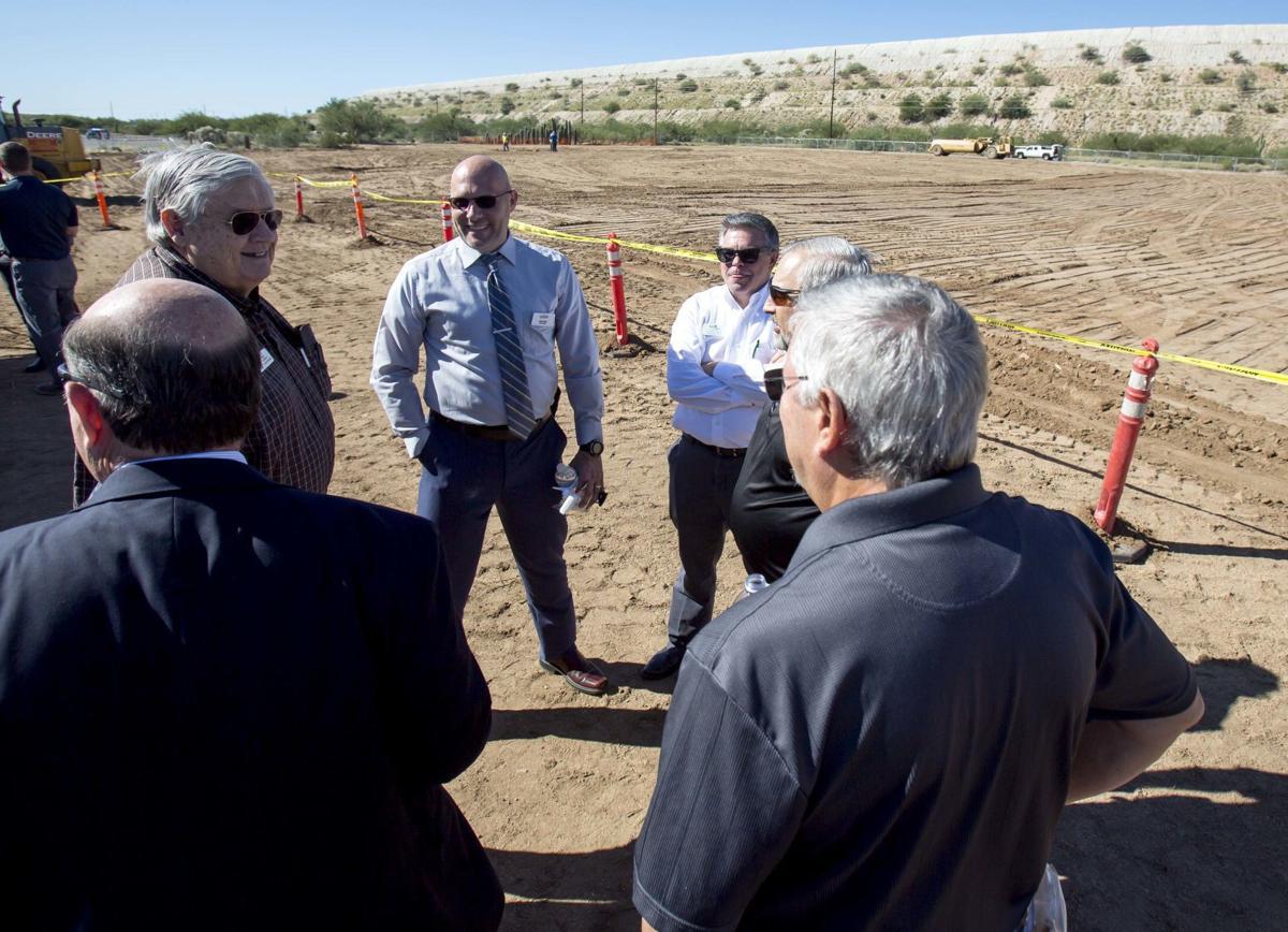 Sahuarita and Green Valley officials talk during the groundbreaking of the Sahuarita Advanced Manufacturing and Technology Center. The 32,000-square-foot building is expected to be completed next summer. Photo Rebecca Sasnett/Arizona Daily Star