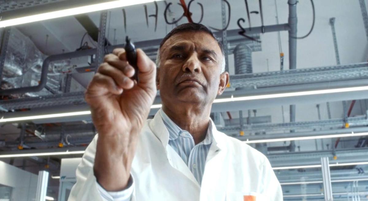 Dr. Ettigounder (“Samy”) Ponnusamy is a key leader in green chemistry at MilliporeSigma. Dr. Ponnusamy wears a lab coat writing out chemical compounds on glass with a marker.