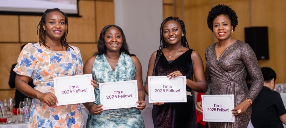 Four people holding signs that read I'm a 2025 Fellow!