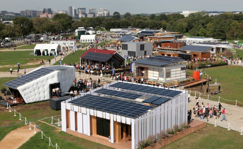 Visitors tour the U.S. Department of Energy Solar Decathlon 2011 in Washington, D.C., Friday, Sept. 30, 2011, with Arlington, VA, left, and the Lincoln Memorial, right, in the background. (Credit: Stefano Paltera/U.S. Department of Energy Solar Decathlon)