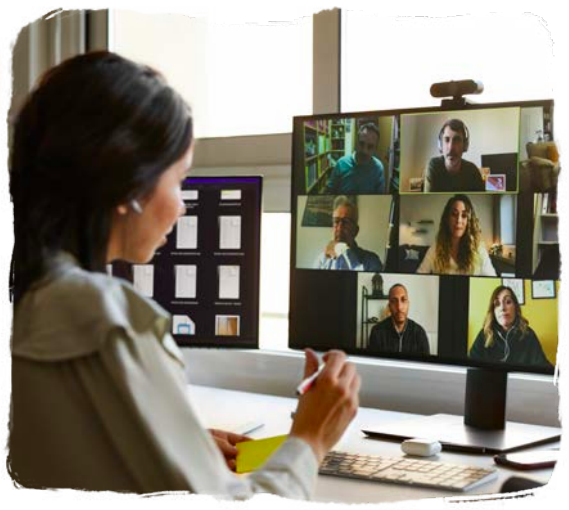 a woman looking at her computer screen on a video call