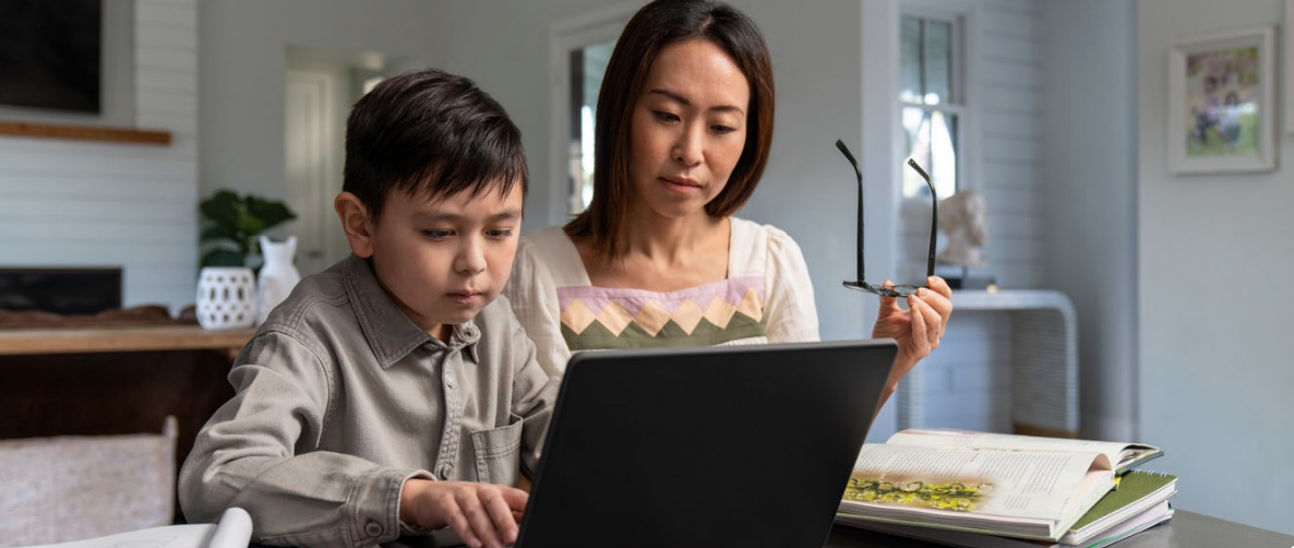 Parent and child using a laptop