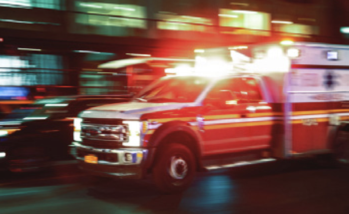 ambulance on a city street at night