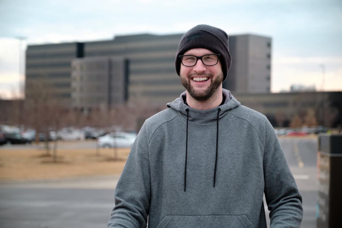 Richard McMichael in a hat and glasses, smiling