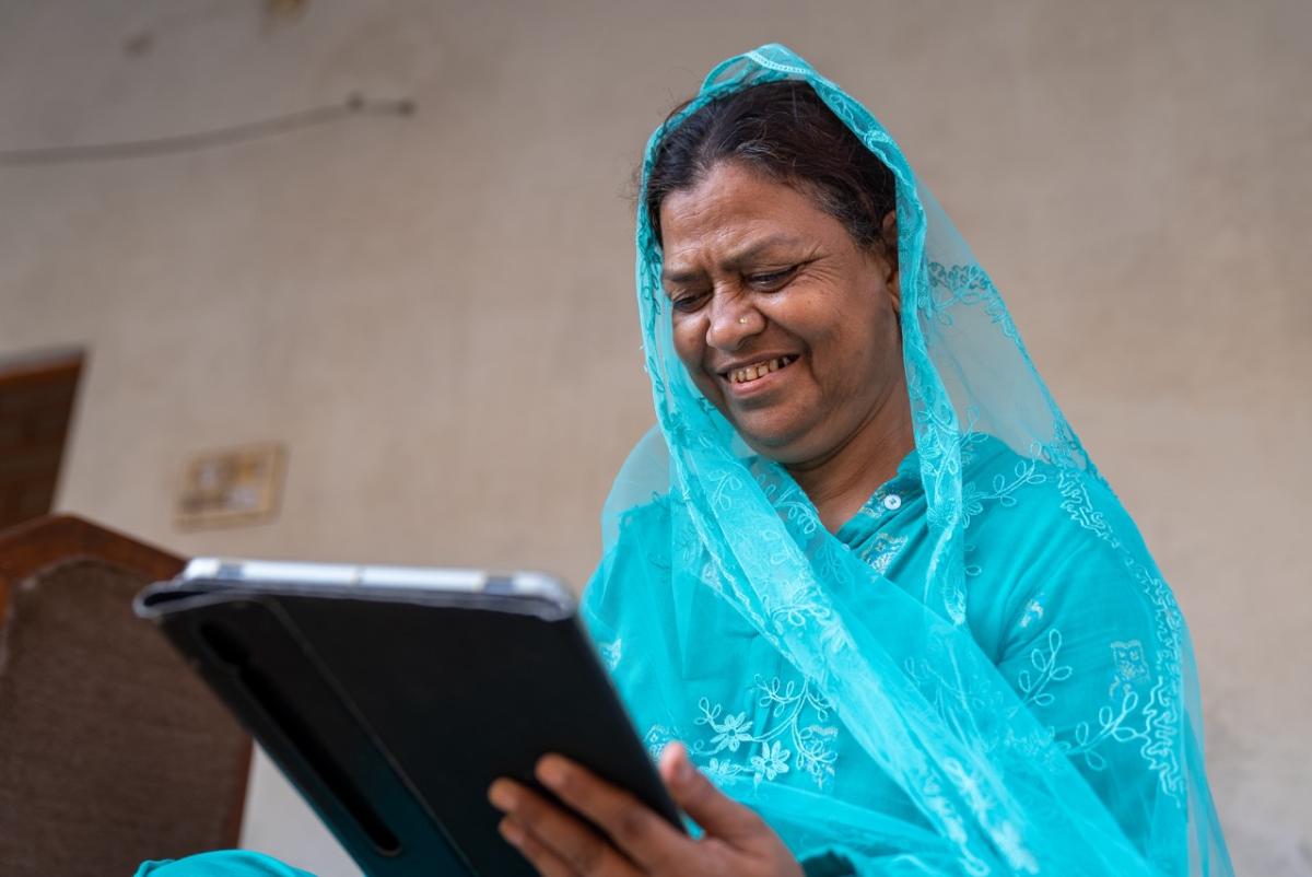 Photo of Shahjahan using her digital tablet.