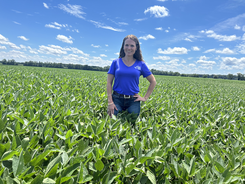 Woman standing in soybean field