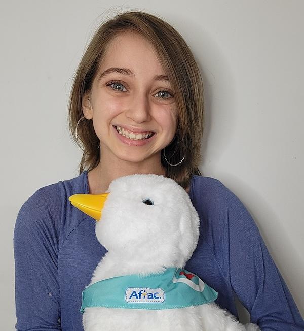 Photo of Shauna Rae holding an Aflac Duck.
