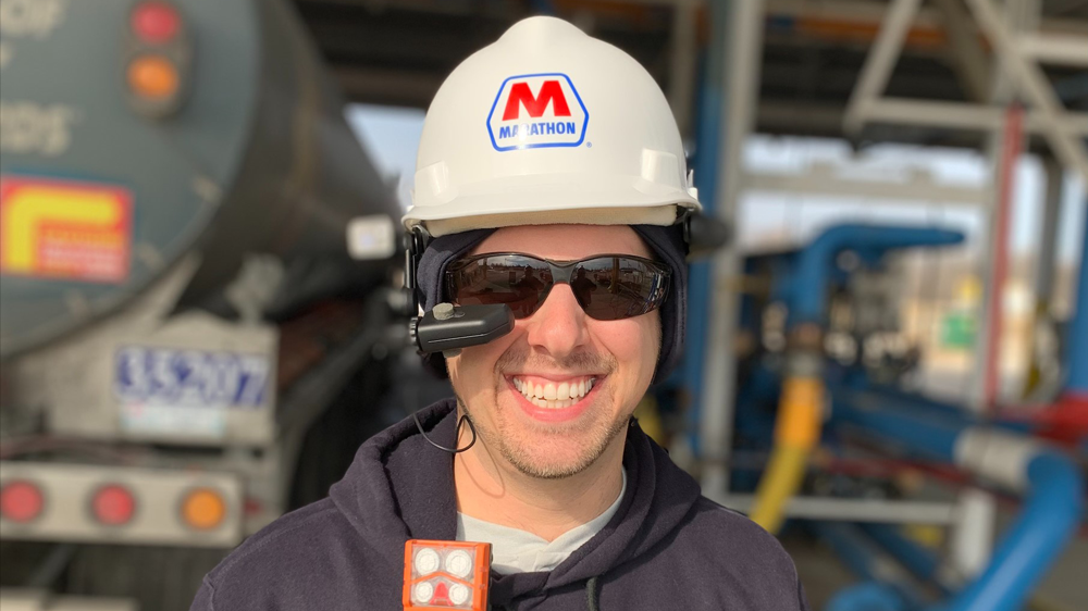 Marathon Petroleum has been using a smart helmet – a hard hat with a camera that enables real-time video communication with remote users – at its Logistics and Storage (L&S) Terminals for troubleshooting, training, collaboration and more. Recently, the technology was put to the test during an important virtual tour. Person smiling and wearing the smart helmet