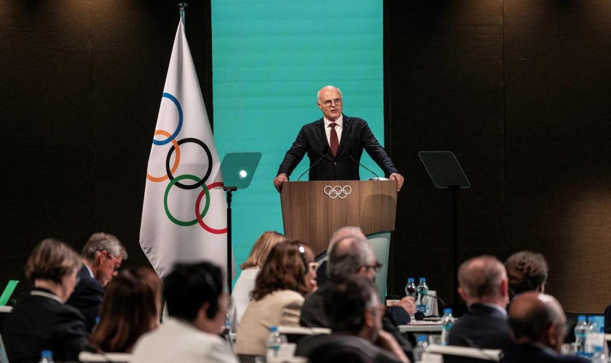 A speaker stood at a podium in front of an audience