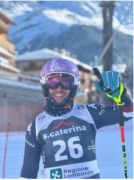 Spencer Wood in ski attire, waving at the camera