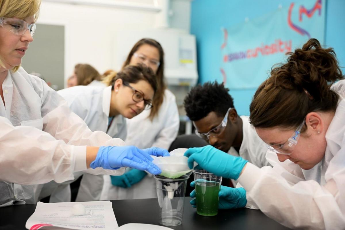 Deanna Folluo (left) and Michelle Vaughan (right) pour liquids through filters as they take part in a water quality lab experiment during a tour at MilliporeSigma with the Washington University STEMpact Teacher Quality Institute on Wednesday, July 18, 2018. The STEMpact Teacher Quality Institute has 150 teachers from 25 school districts taking part in the year long program to improve teachers' ability to teach STEM in the classroom. Photo by David Carson, dcarson@post-dispatch.com