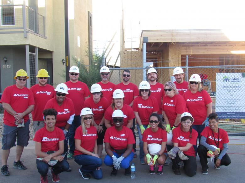 State Farm employees in Phoenix kick off celebrating the company's 10-year anniversary of partnering with Habitat for Humanity. During the month of October, employees will volunteer in Phoenix, Dallas and Atlanta.
