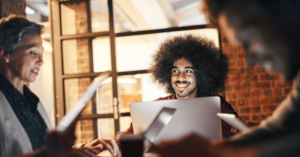 people smiling in a meeting