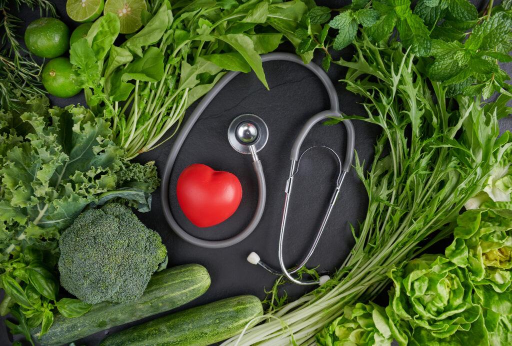 Image by Freepik* A stethoscope and a small heart are shown with produce.