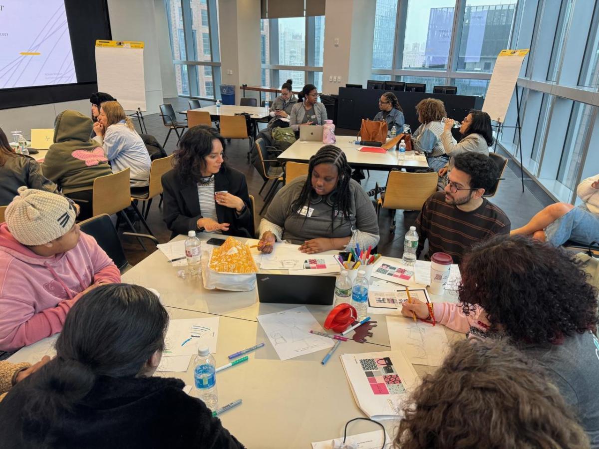 Students gathered around a table at Career Discovery Week at Tapestry HQ