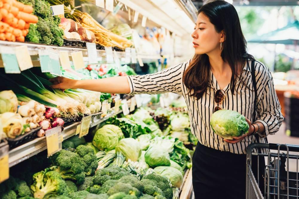 Picking produce at grocery store