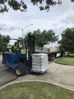 pallet of packaged supplies being moved