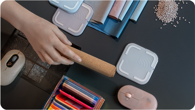 desk with hands and Logitech products shown on top
