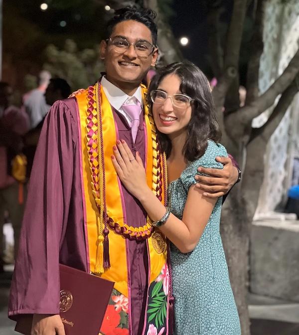 Tanishq and a young woman at his graduation. 