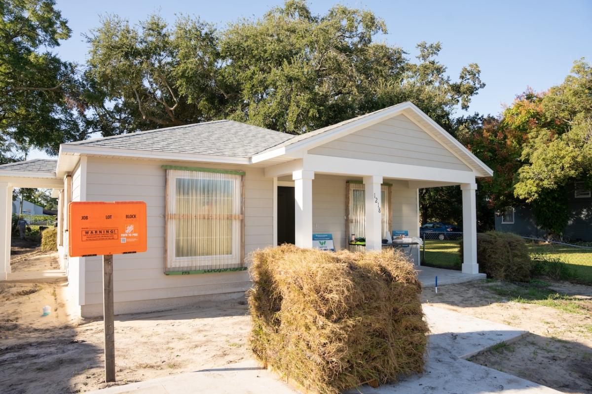 House shown with the lawn to be installed.