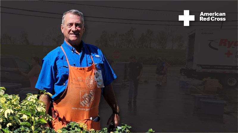 Mark Millia shown in Orange Apron with Red Cross Symbol.