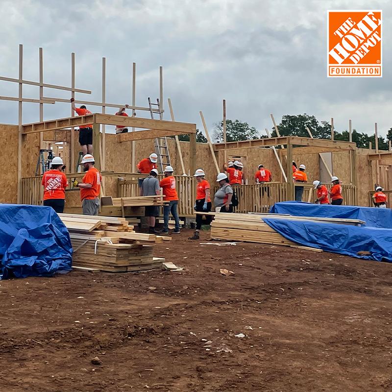The Home Depot Foundation team members working on a building site.