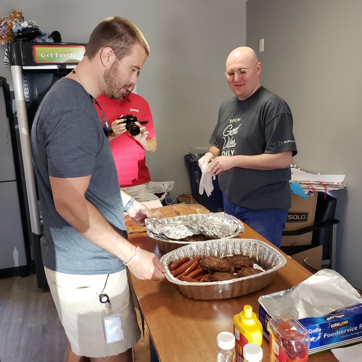 Blackbaud Customer Advocacy Manager Tim Newborn serves meals at the Affordable Veterans Housing Projects with other members of the Blackbaud Veterans affinity group.