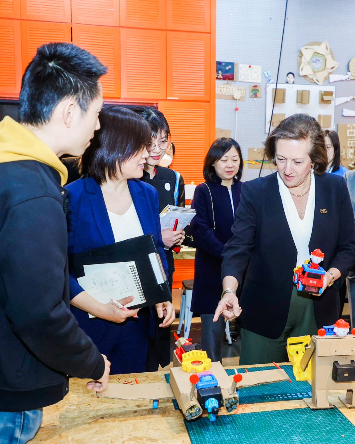 Otis Chair, CEO & President Judy Marks tours a youth innovation zone made possible by the China Soong Ching Ling Foundation. The non-governmental organization and Otis announced a partnership that will deliver scholarships to outstanding female university students with a focus on Science, Technology, Engineering and Math (STEM). The funding will also support STEM innovation programs for youth