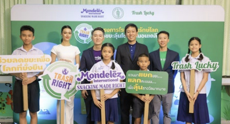 Students and staff holding TRASH RIGHT signs