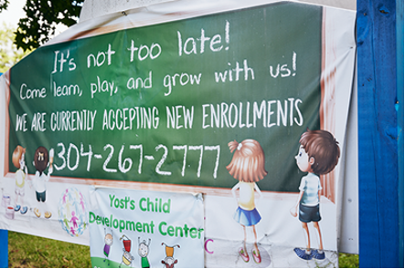 Sign reading 'It's not too late! Come learn play and Grow with us! We are currently accepting new enrollments'