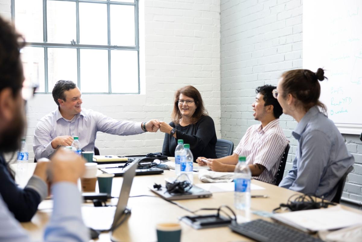 people sitting at conference table